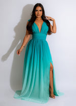 Long, flowy green maxi dress with a v-neck and empire waist