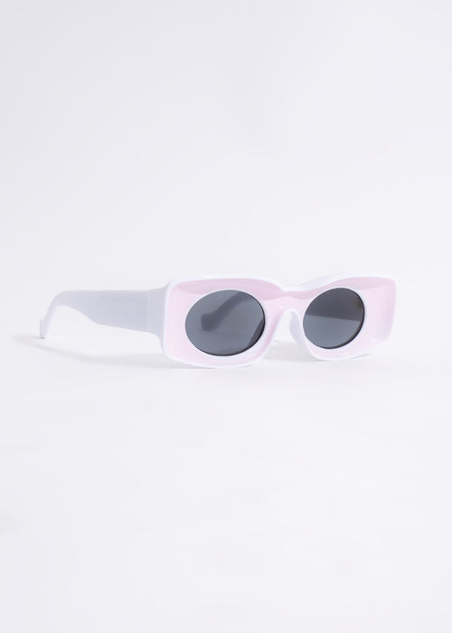 Pink sunglasses with UV protection and chic design, perfect for traveling