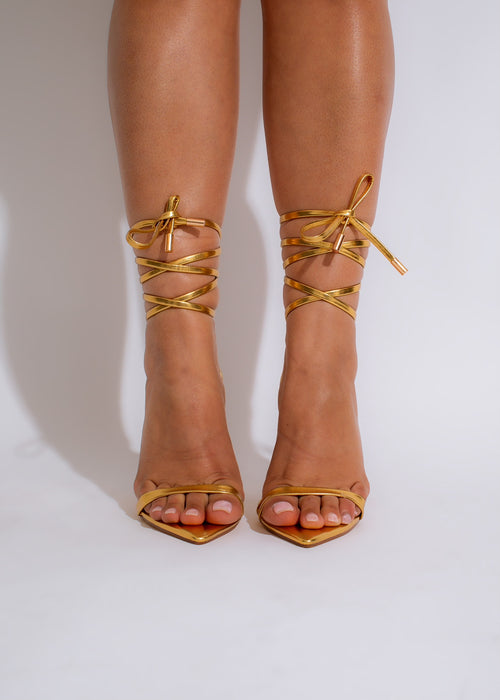 Shimmering gold metallic heels with open toe and ankle strap