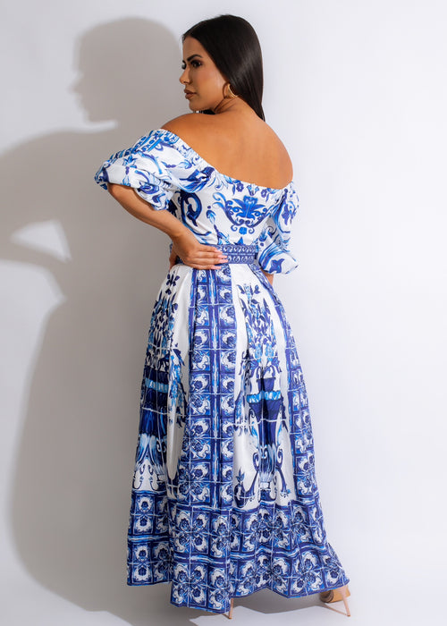 Elegant and sophisticated off-the-shoulder maxi dress with intricate lace detailing and flattering cinched waist for a timeless look