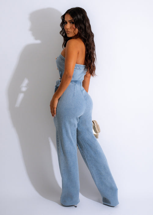  Front view of the Take Me On Denim Jumpsuit featuring a flattering V-neckline and wide-leg silhouette for a trendy vibe