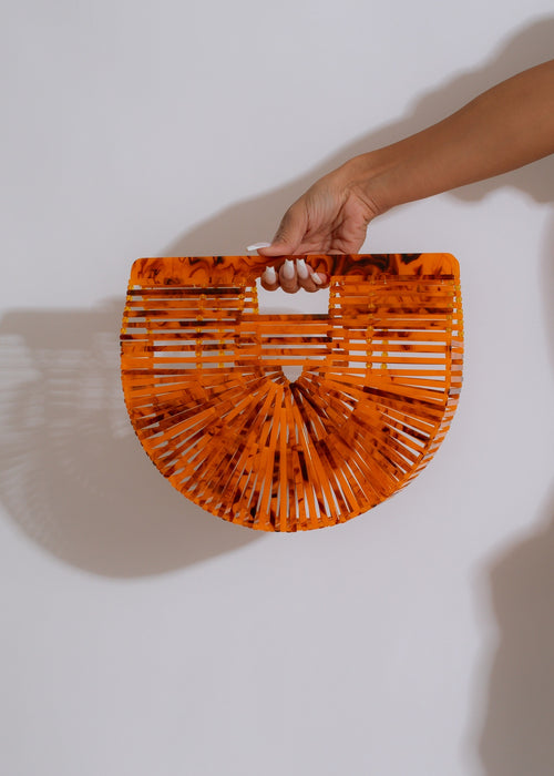 New Lover Tye Die Handbag Orange displayed on a white background with a beautiful tie-dye pattern and silver hardware, perfect for adding a pop of color to any outfit