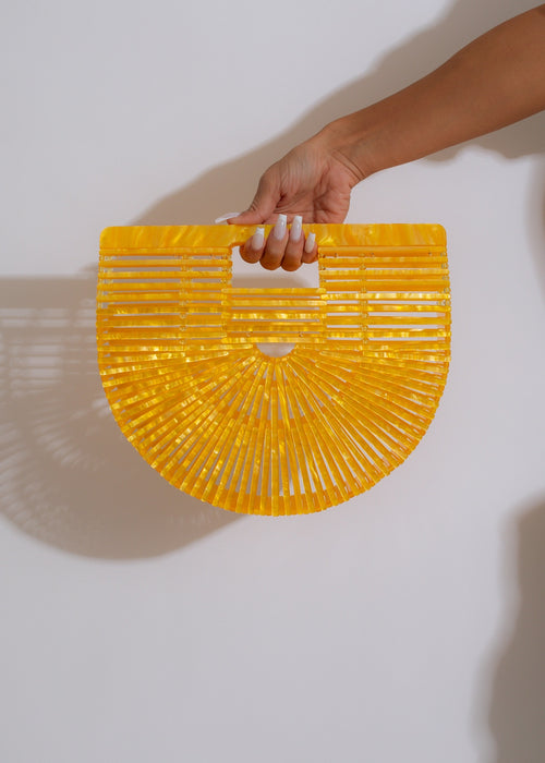Alt text: Stylish and chic New Lover Handbag in sunshine yellow, perfect for any outfit