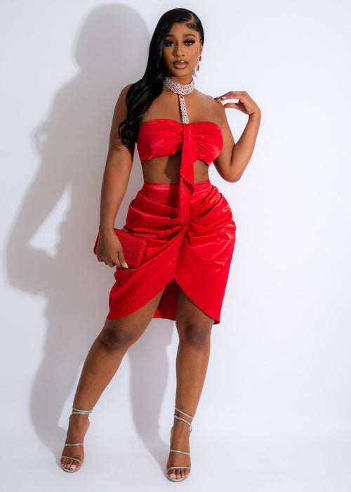 Red satin skirt and top set adorned with sparkling rhinestones for a glamorous look