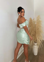 A luxurious and elegant green satin skirt set for sophisticated women