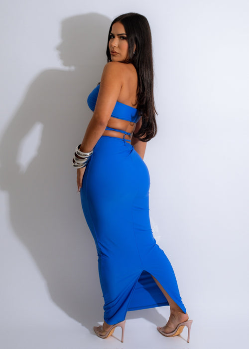  Stunning two-piece set featuring a blue skirt and matching top with intricate pearl details