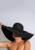 Stylish black Luxury Vacay Hat with wide brim and ribbon detail