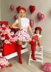 Two-piece skirt set for kids featuring vibrant heart pattern and ruffled detail