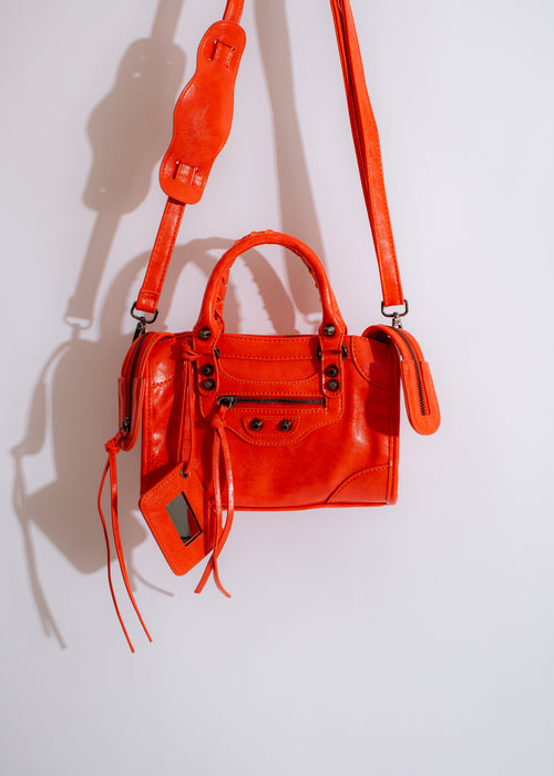 Stylish and trendy Girl Code Handbag in vibrant orange color