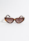 Oval brown sunglasses with tinted lenses and sleek design for stylish look