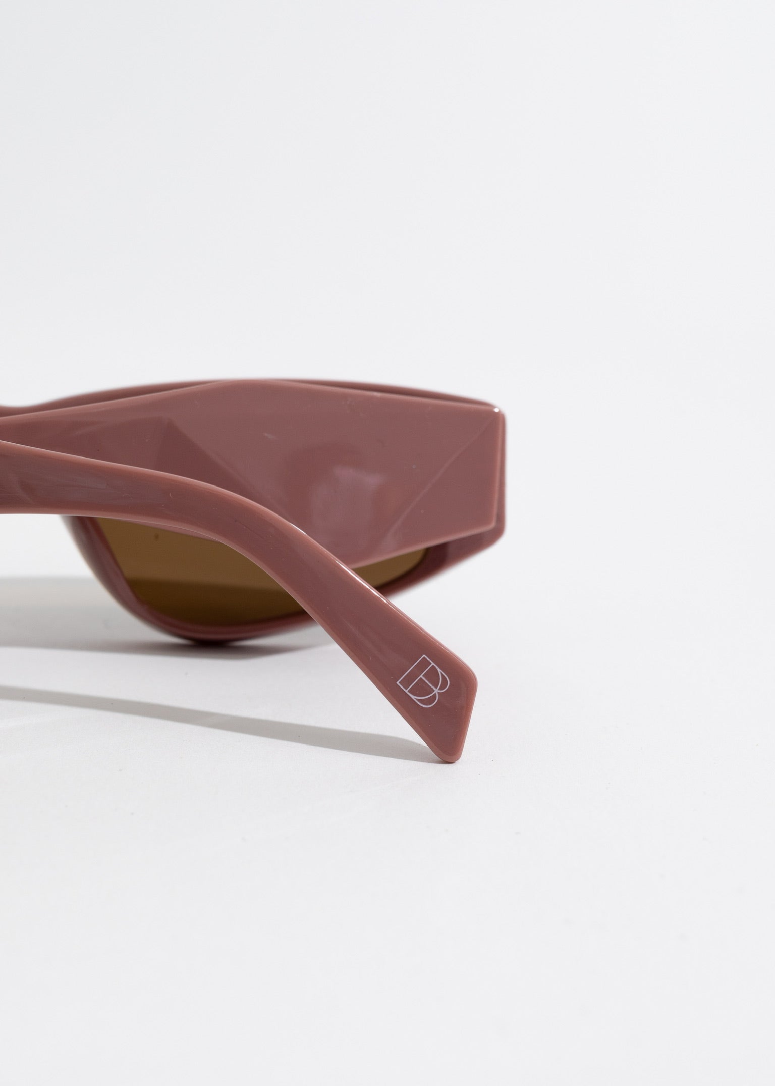 Stylish pink oval sunglasses with a modern design for a chic look