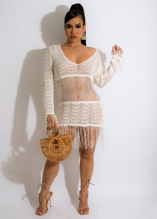 Stylish white crochet cover up with intricate patterns and flowy design for beach or poolside wear