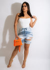 I'm Innocent Short in light blue denim with frayed hem and distressed details, perfect for everyday casual wear