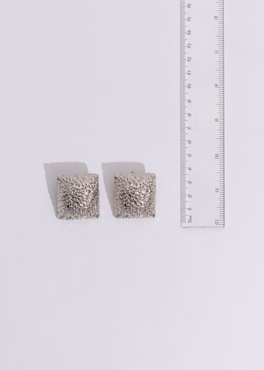 Elegant silver earrings featuring a stunning cityscape motif, ideal for a night out in the city