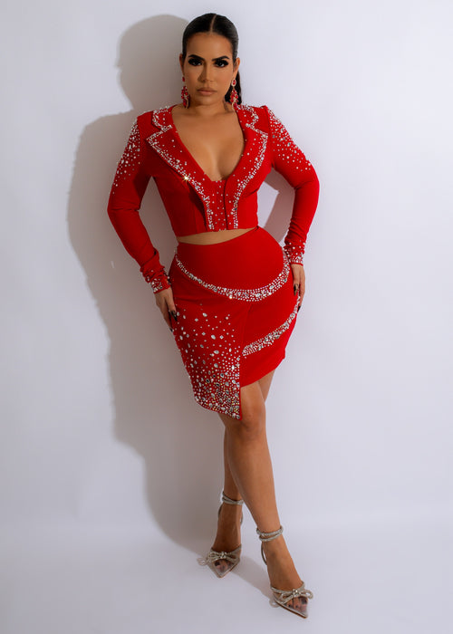 Close-up of red rhinestone skirt set with matching top and accessories