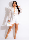 Beautiful woman wearing a lace romper with a flattering cinched waist