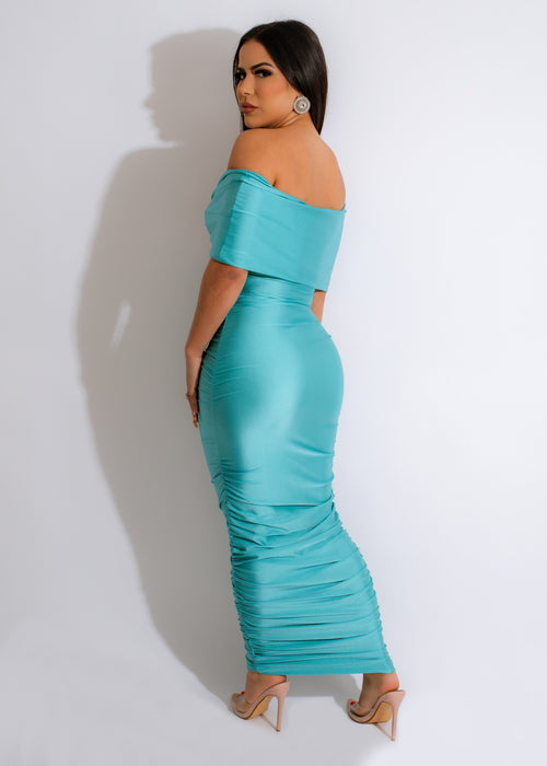 Alt text: Stunning blue ruched maxi dress with a flowy design and adjustable straps, perfect for a free-spirited summer look