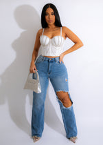 Light denim jeans with distressed detailing, perfect for a casual, stylish look