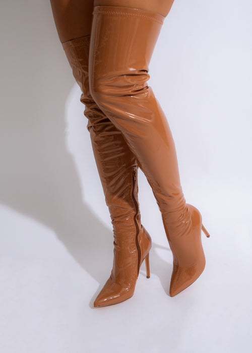 These stunning brown knee-high boots are made of high-quality latex, offering both durability and style for any occasion