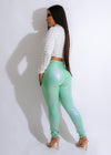 Shimmery and eye-catching green metallic pants, perfect for making a bold fashion statement
