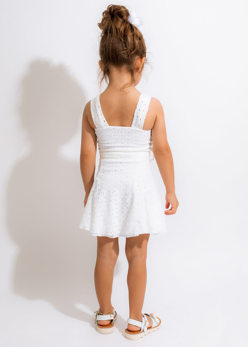 Close up of the Angel Energy Kid Dress's delicate lace details and sweet ribbon bow