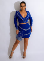 Rhinestone-embellished blue skirt set with matching crop top and sparkling details