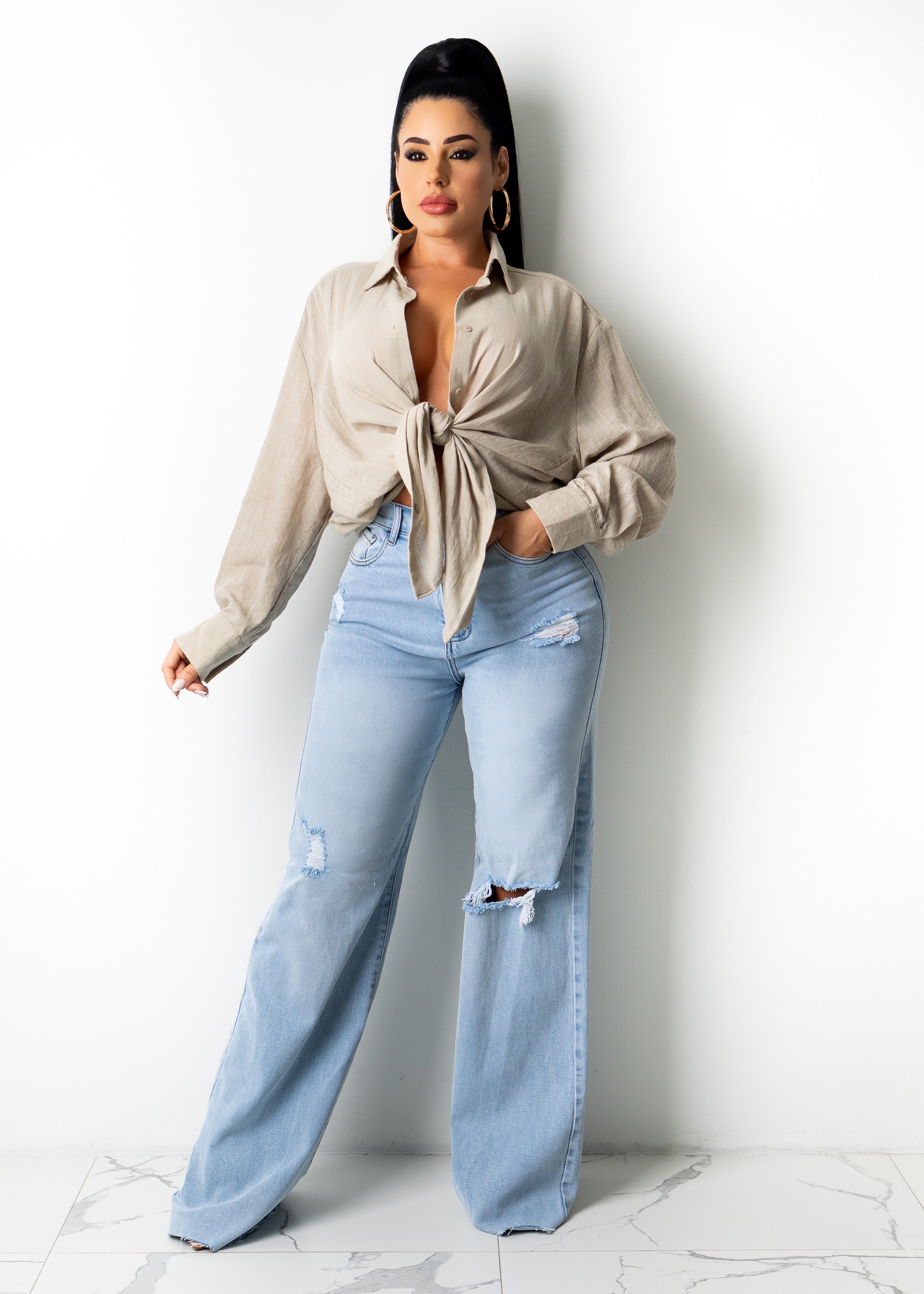 A pair of classic blue denim jeans with a straight cut, featuring a comfortable and flattering fit for everyday wear