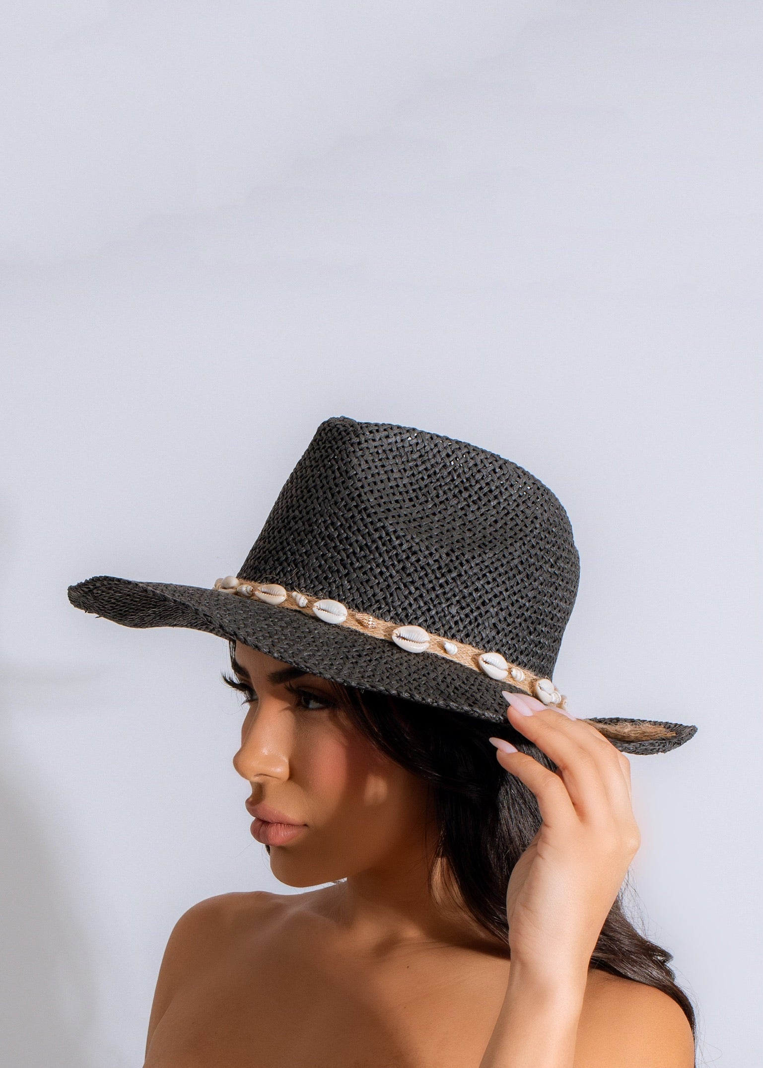 Black wide-brimmed floppy hat with tie detail and beach vibes