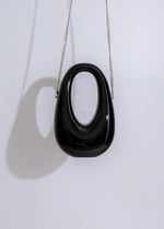  Chic Bad Habit handbag in black, featuring multiple compartments and secure zipper closure