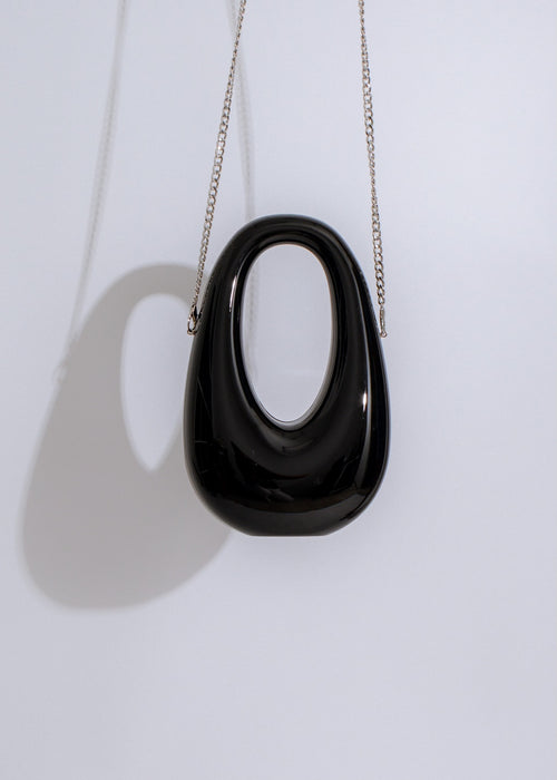  Chic Bad Habit handbag in black, featuring multiple compartments and secure zipper closure