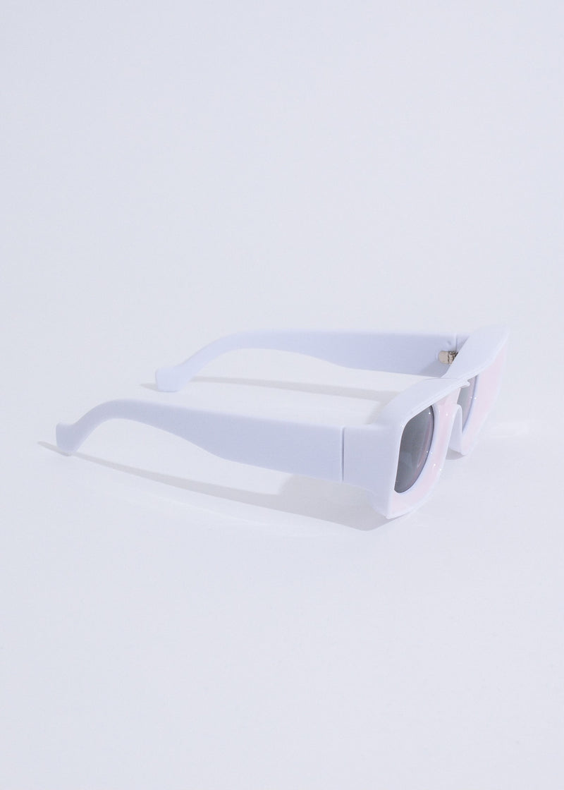 Alt text: Stylish and trendy On A Trip sunglasses in a vibrant pink color, perfect for adding a pop of color to any outfit while protecting your eyes from the sun