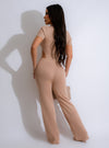 Two-piece nude ribbed pant set featuring a high-waisted design and crop top