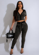 I'm Capricious Knit Jogger Set Black is a trendy and comfortable loungewear set consisting of a black knit sweater and matching jogger pants with a drawstring waist and ribbed cuffs