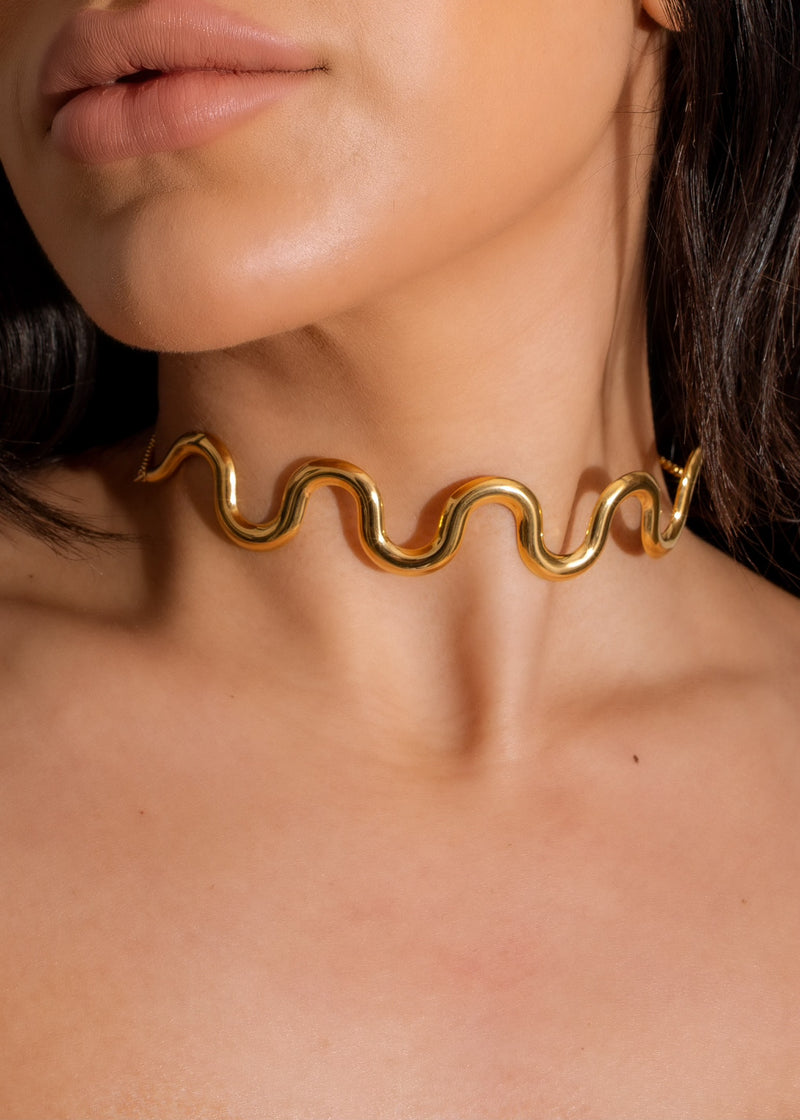 Never The Less Choker Gold, a stylish and elegant accessory for any outfit