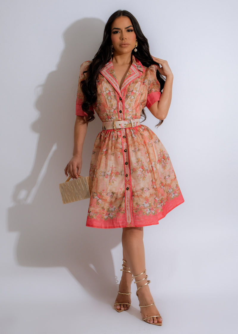 Bloom Whisper Mini Dress Pink with beautiful floral pattern and ruffle details, perfect for summer occasions and outdoor events