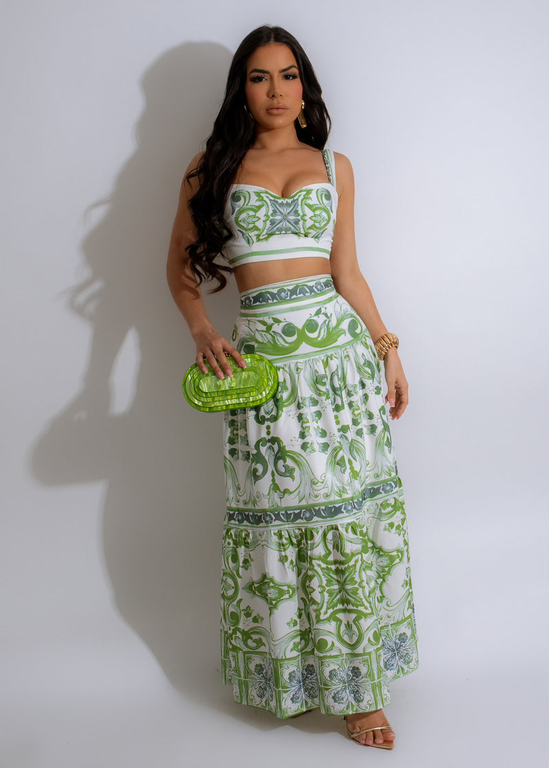 Two-piece green skirt set with floral print and ruffle details