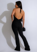 Stylish and chic black jumpsuit with mesh detailing, perfect for city nights out