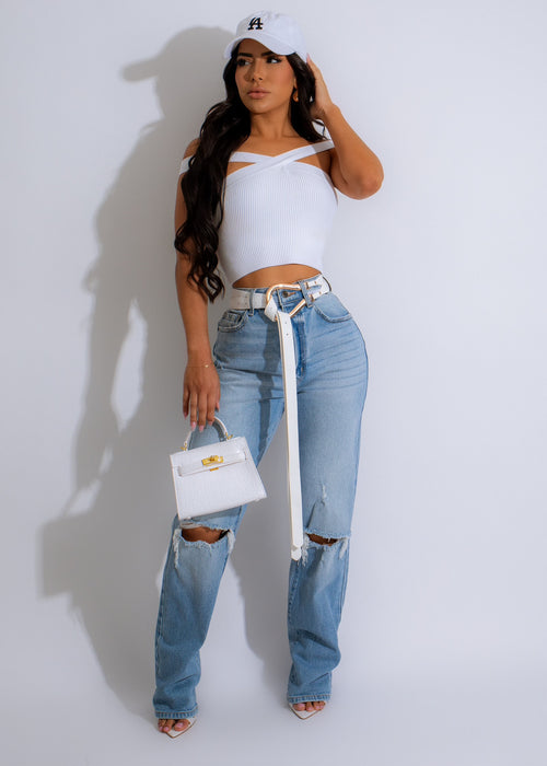 Light denim ripped jeans with distressed detailing and frayed hem for a stylish look