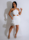  A side view of the mini dress showing the fitted waist and flared skirt