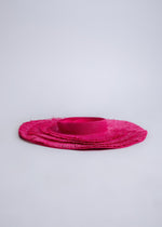 Straw hat in a fashionable pink color, perfect for sunny days