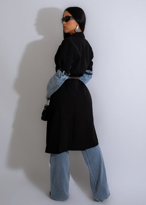  Close-up of the back of the Wildest Dream Denim Cardigan Black, showcasing the oversized fit and raw hem