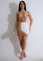 Faux leather white mini dress with rhinestone embellishments and a plot twist design