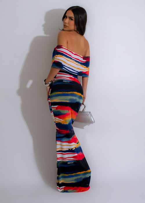  Gorgeous blue maxi dress featuring a stunning sunset-inspired print, designed to make a statement and turn heads at any event or gathering