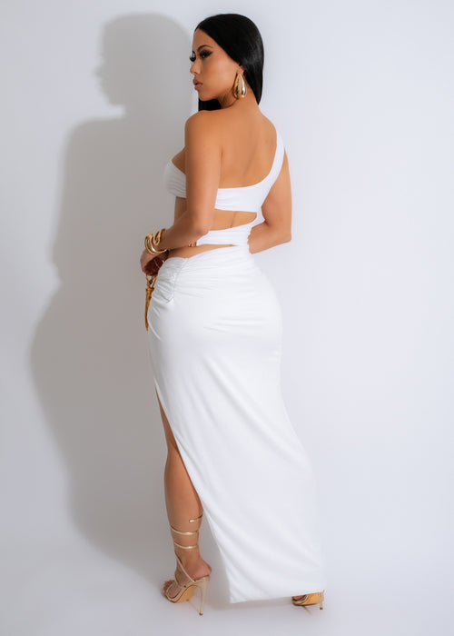 White ruched maxi dress with a flowing silhouette and elegant design