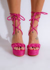Pink platform heels featuring a striking design for a bold look