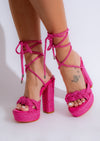 High-heeled pink platform shoes with eye-catching design