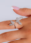 I Feel Butterflies Ring Silver on woman's hand with delicate details
