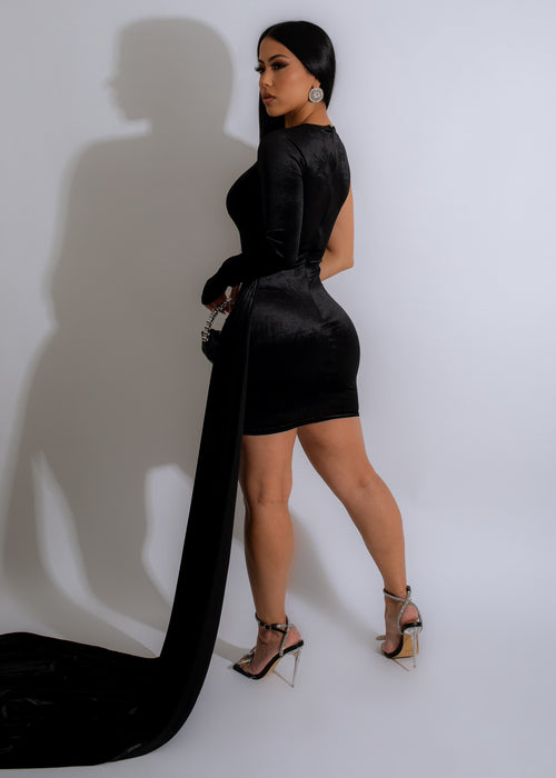  Fashionable woman wearing a black mixed signals velvet mesh rhinestones mini dress