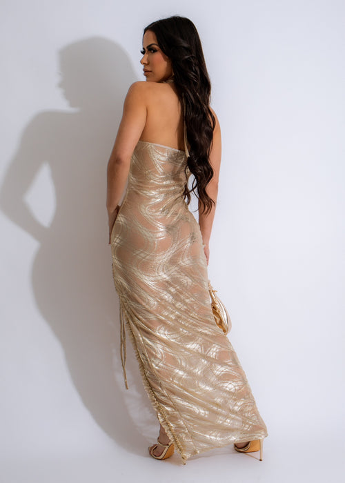  Full-length image of a smiling girl wearing a glamorous gold maxi dress with a flowing mesh skirt, ideal for a formal event or dance celebration