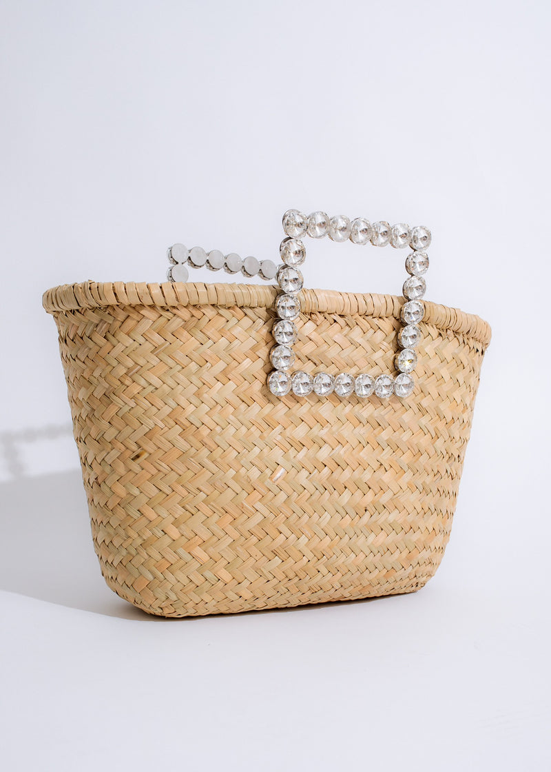 Chic nude handbag with multiple compartments and tassel detail